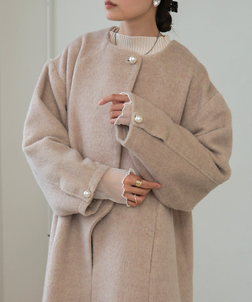 SHAGGY PEARL BUTTON OVER SILHOUETTE COAT