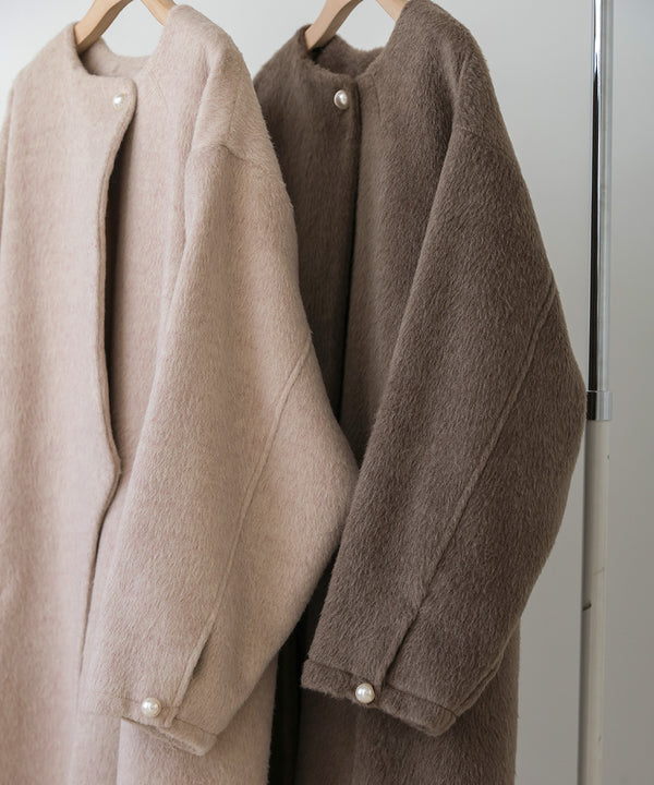 SHAGGY PEARL BUTTON OVER SILHOUETTE COAT