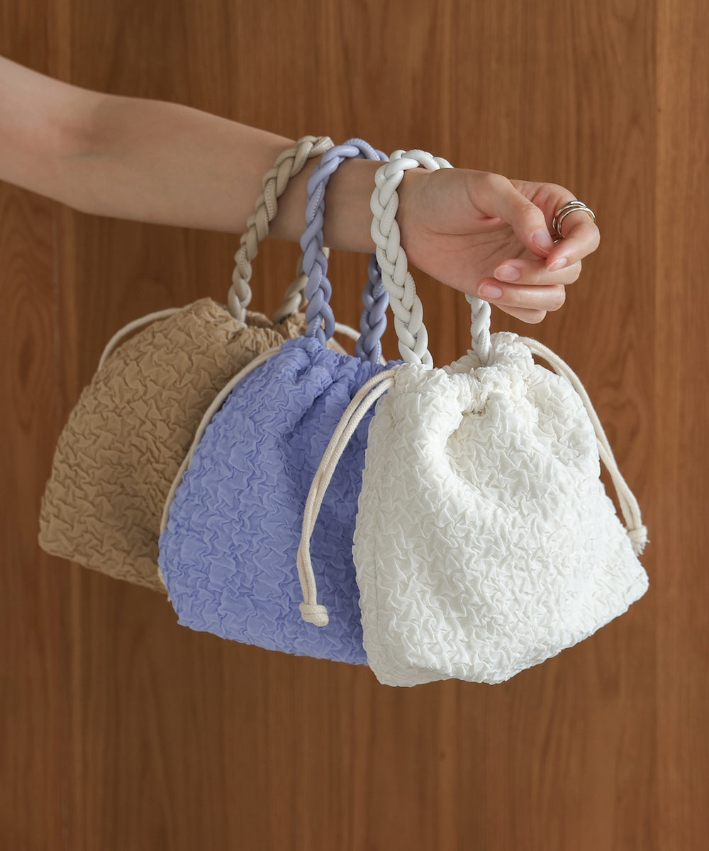Knitted handle drawstring bag